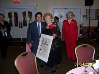 2. City Council member Vincent J. Gentile presents a Council proclamation to Rose Giannini Lood, longtime New Utrecht Reforned Church member and community leader, on her 90th birthday at a party at Bay Ridge Manor. Mrs. Lood's daughter, Susan Hanyen, stands nearby.