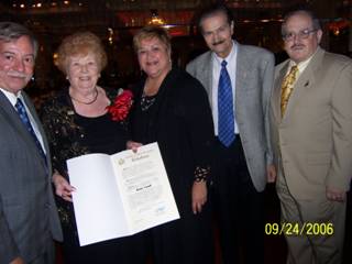 3. State Assemblyman Peter J. Abbate, Jr., presents Rose Giannini Lood with a proclamation noting her 90th birthday. Left to right: Abbate, Mrs. Lood, District leader Delia Schack, Robert Buonovino and Supreme Court Justice Arthur M. Schack.