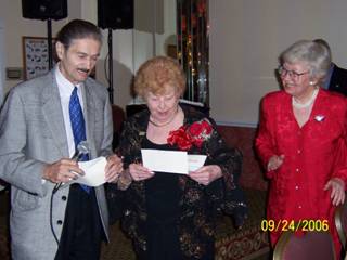 4. Robert Buonvino, President of Friends of Historic New Utrecht, presents a $21,000 check to Rose Giannini Lood to be used toward restoration of the New Utrecht Reformed Church. Mrs. Lood, at her 90th birthday celebration at Bay Ridge Manor, asked that anyone giving gifts put them toward restoring the historic church sanctuary.