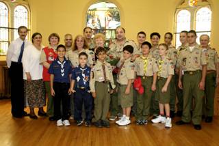 5.Cub Scouts, Boy Scouts of Troop 20, the country's oldest troop, are among those who celebrated the 90th birthday of church member and community leader Rose Giannini Rose (Center) in the Parish House of the New Utrecht Reformed Church, near the historic sanctuary where an extensive $2 million repair and restoration is under way.